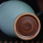 Base and foot detail of the contemporary Longquan celadon vase