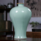 Celadon Meiping vase displayed on a contemporary cabinet