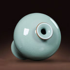 Top view of the small mouth and celadon-glazed shoulder