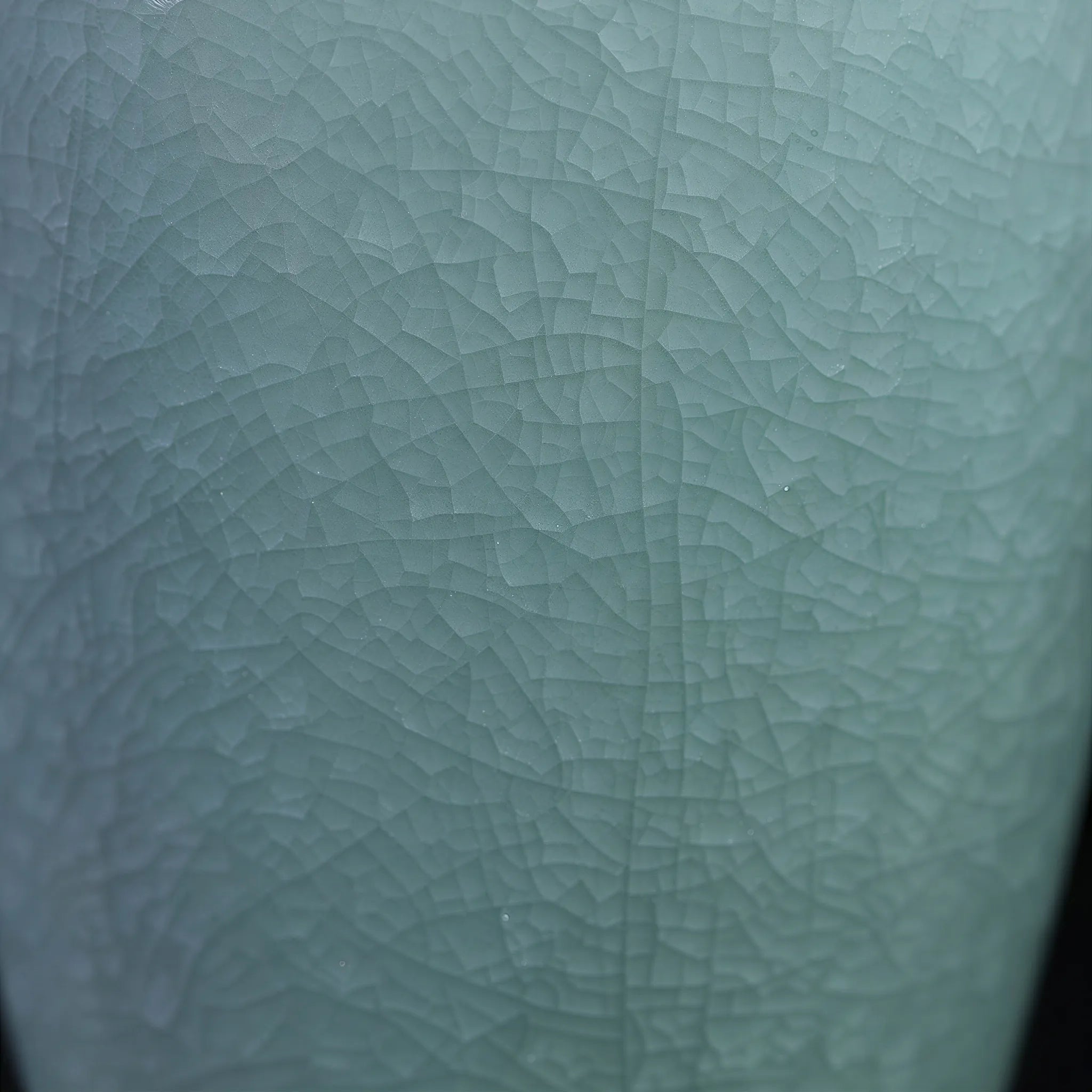 Fine crackle network in the pale Longquan celadon glaze