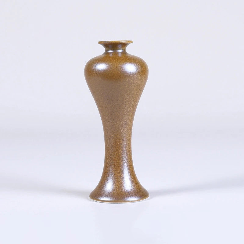 Meiping high-shouldered maple-yellow mini porcelain vase with a tall slender body.