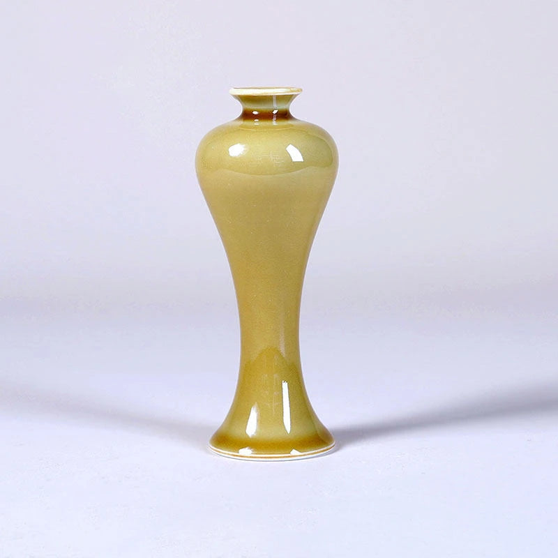 Tall luminous yellow porcelain meiping vase with narrow mouth and flared foot