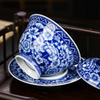 Tilted gaiwan bowl resting on the broad saucer
