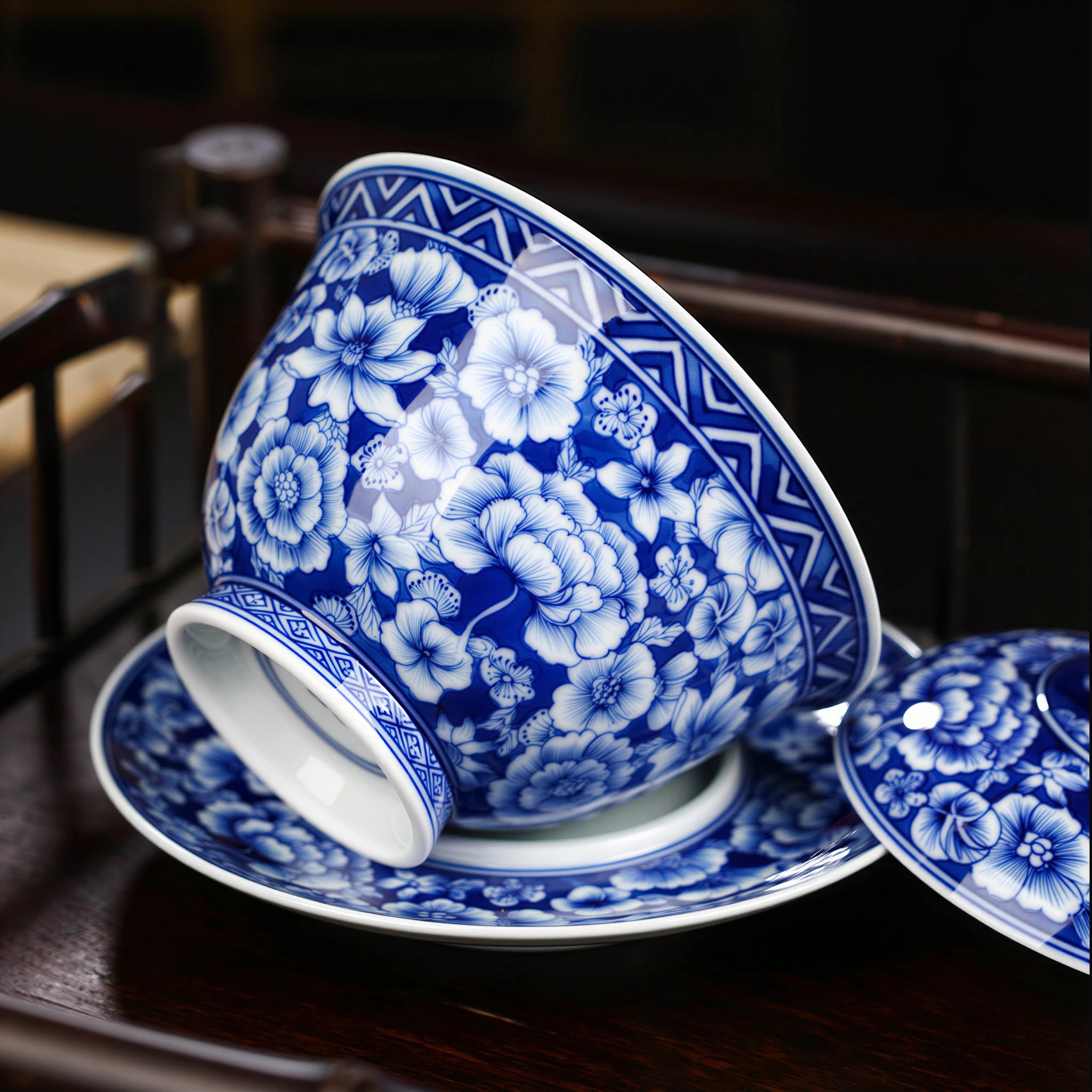 Tilted gaiwan bowl resting on the broad saucer