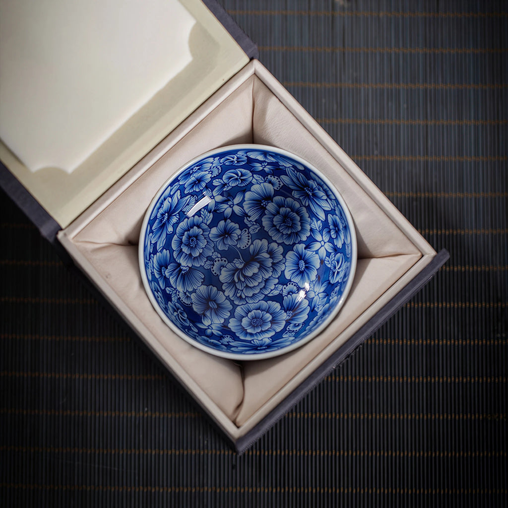 Blue-and-white millefleurs teacup in its presentation box