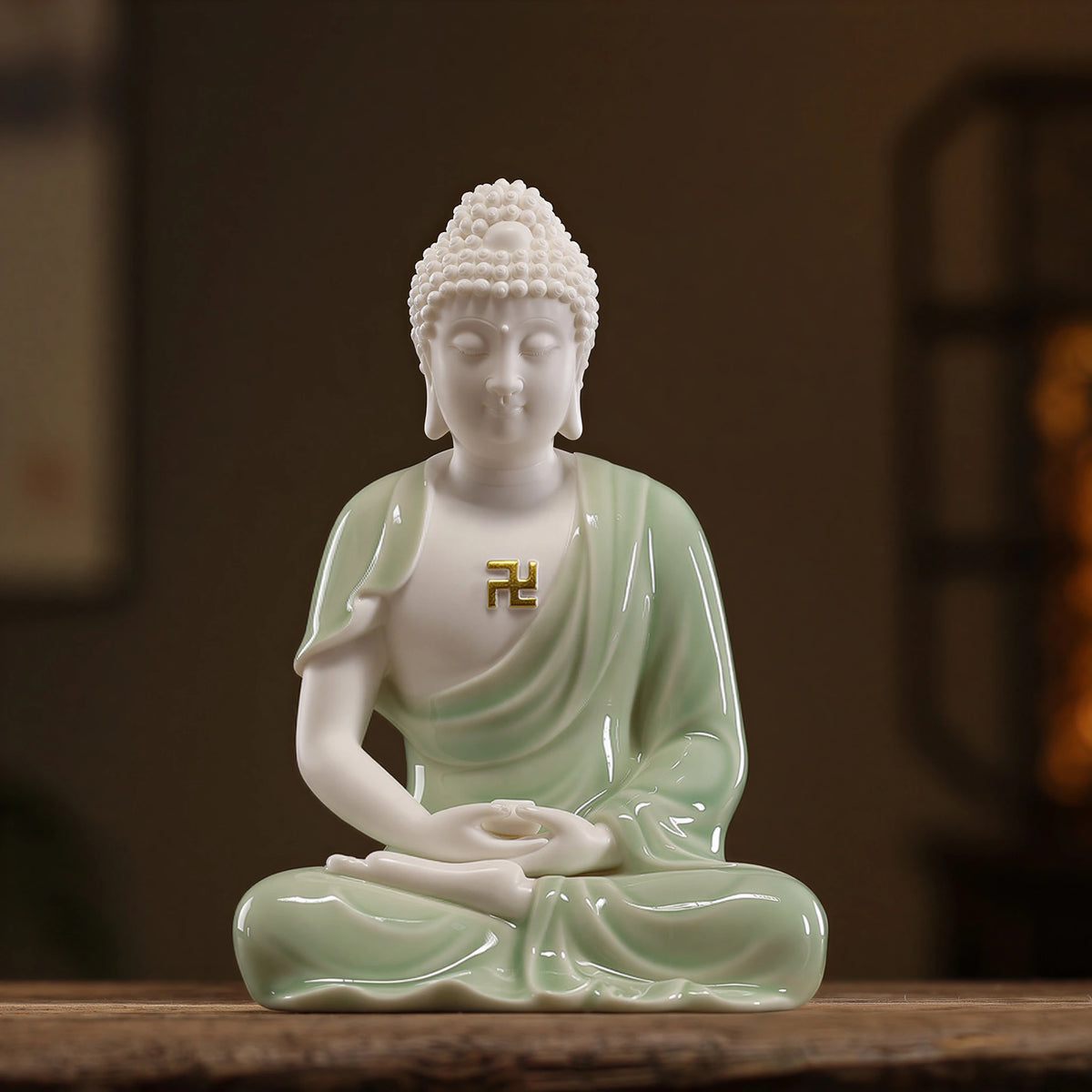 Pale celadon glazed Dehua Amitabha Buddha seated with hands in dhyana mudra
