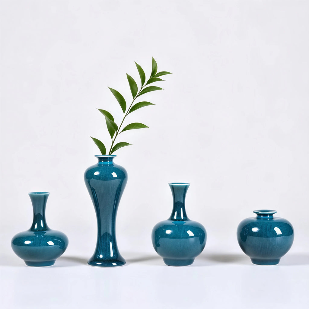 Peacock green porcelain vases styled with single green stems