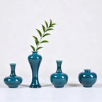 Peacock green porcelain vases styled with single green stems