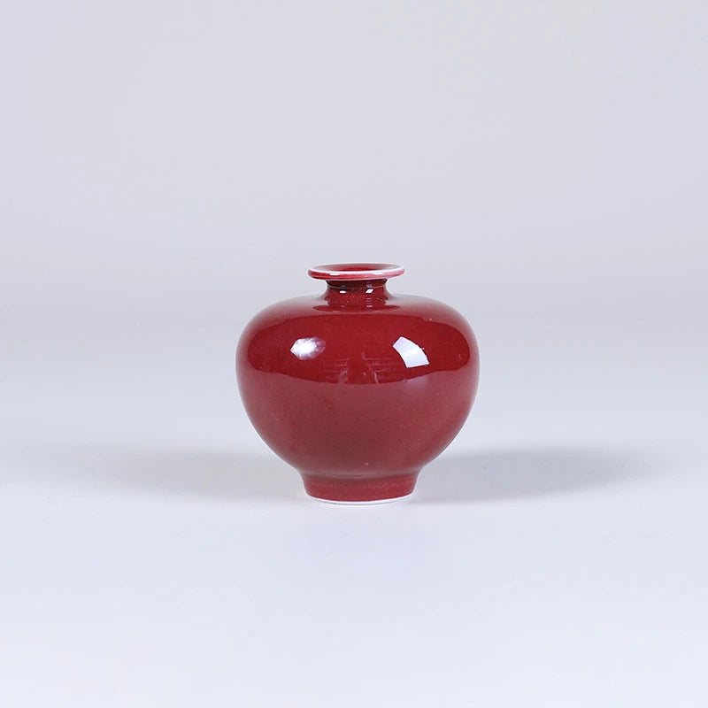Compact pomegranate-form oxblood red mini porcelain vas
