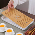 Slotted bamboo dry tray shown separately from the tea set