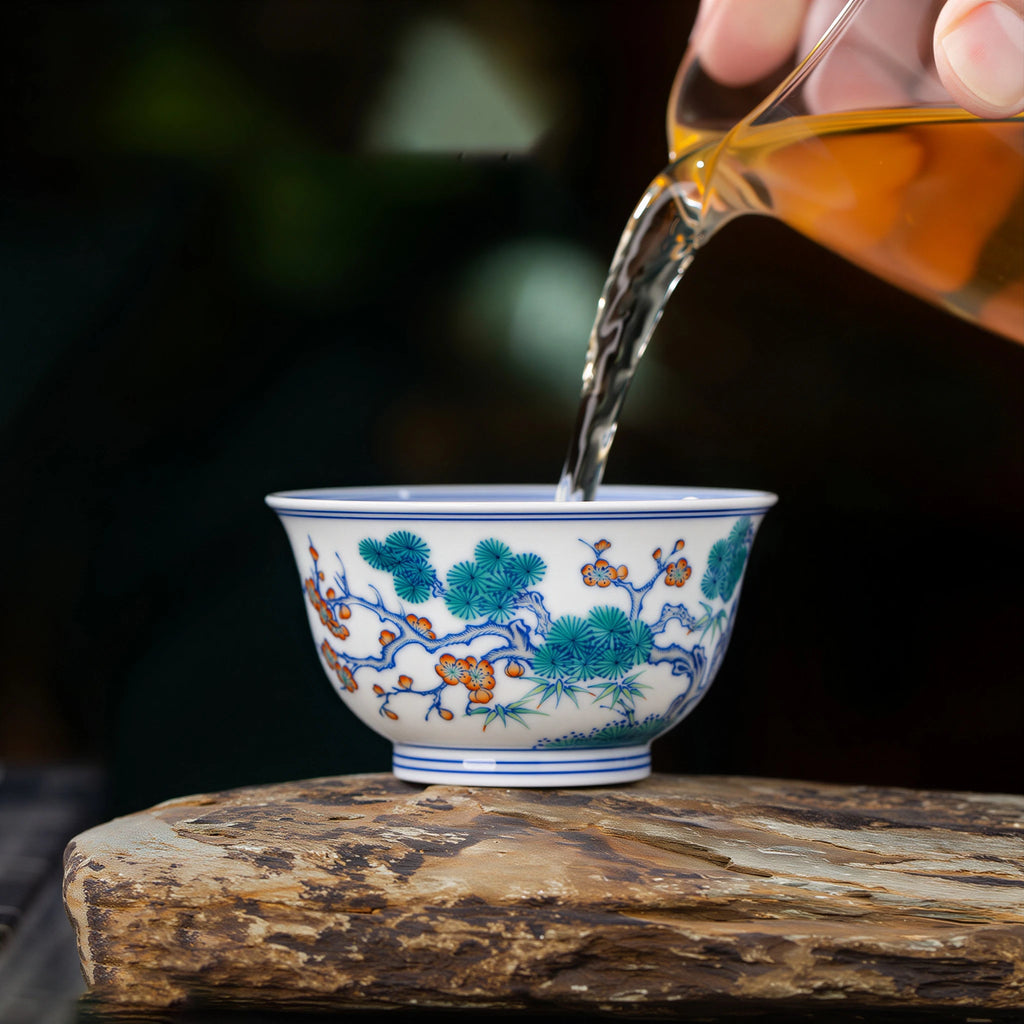 Tea being poured into the Three Friends doucai cup