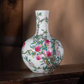 Front view of a Qianlong-style famille rose nine-peach Tianqiu vase