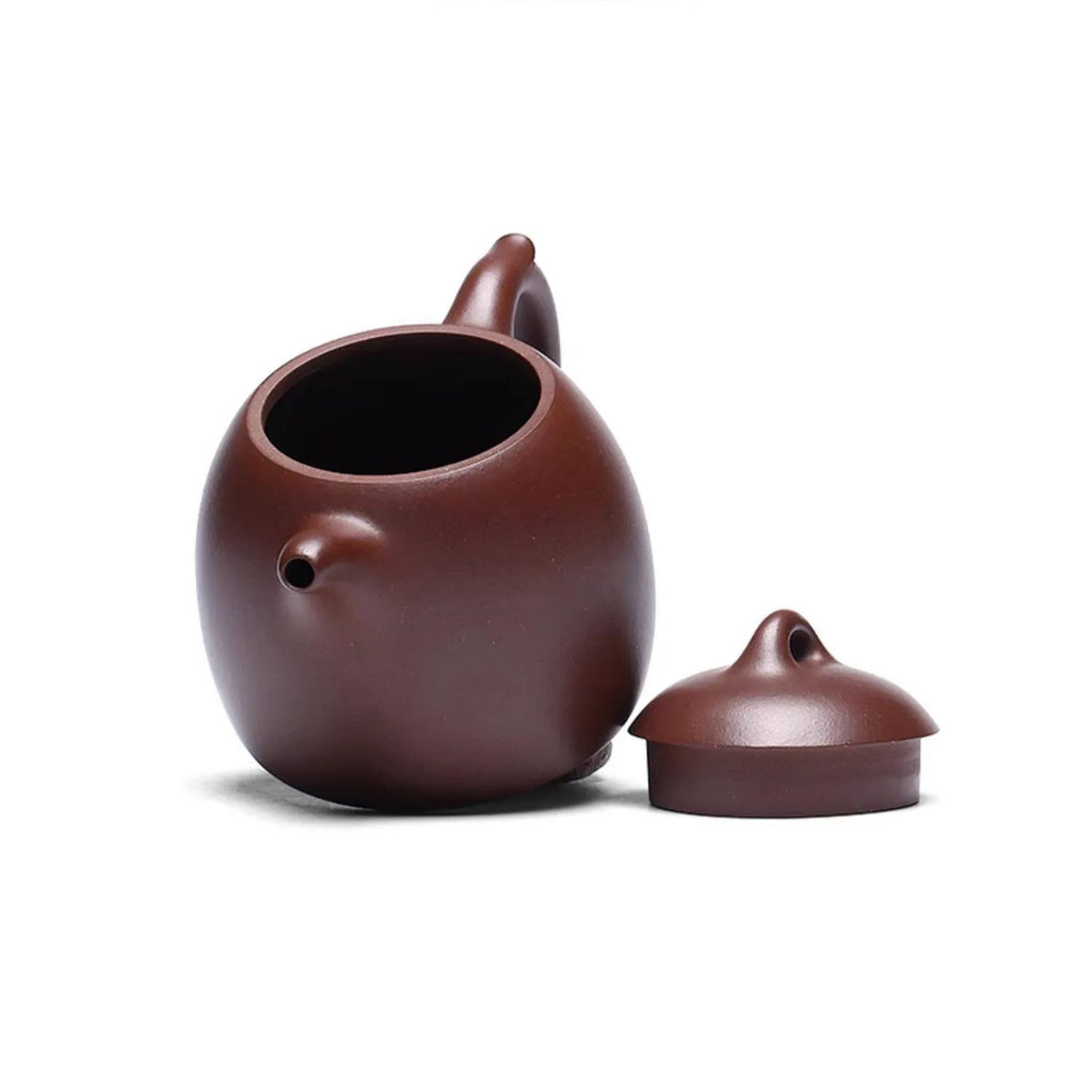 Open Qin Quan teapot shown with its domed lid removed