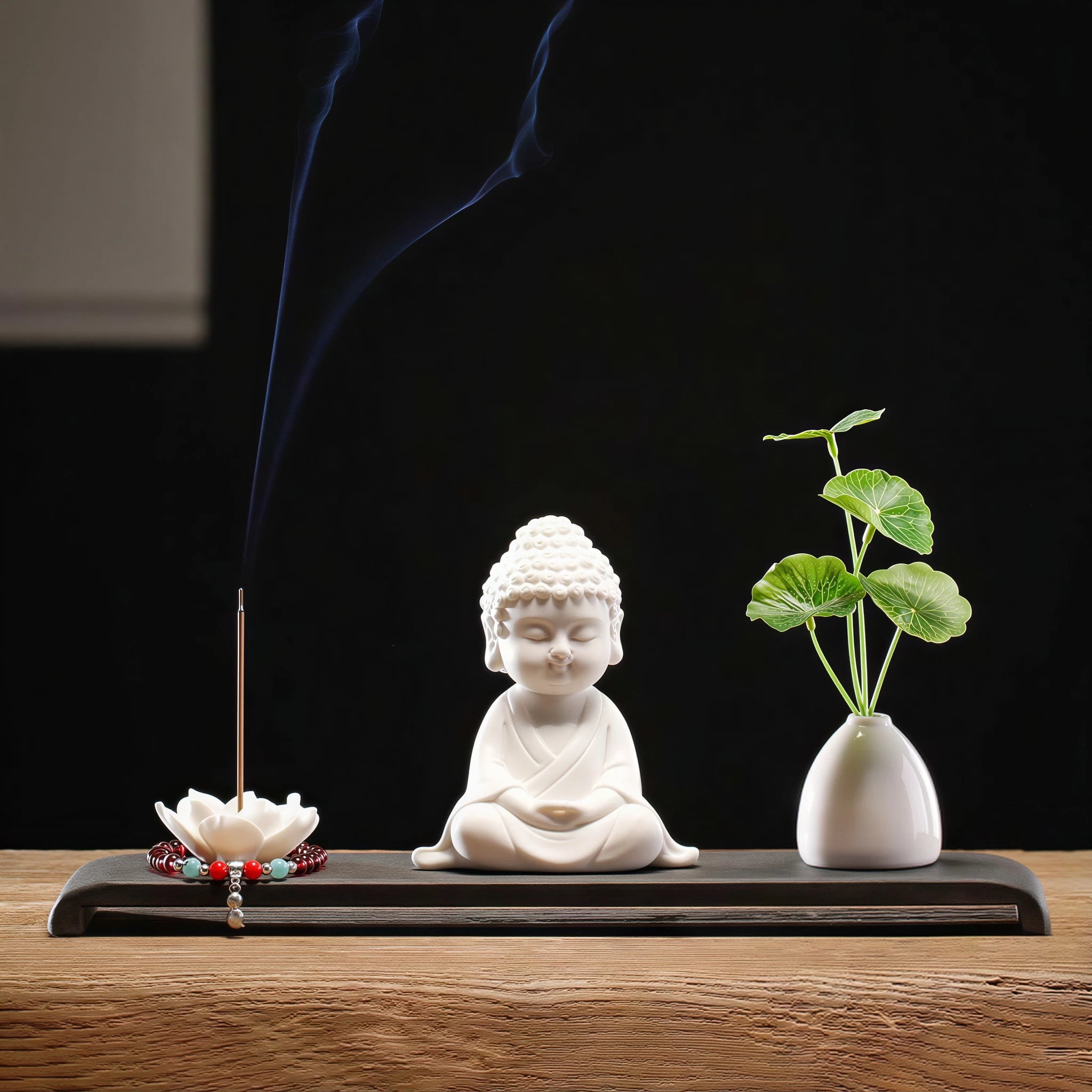 Serenity pose Buddha arranged with incense holder and bud vase