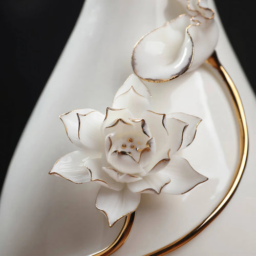 Close view of the raised lotus petals, stem, and gold-toned outlines