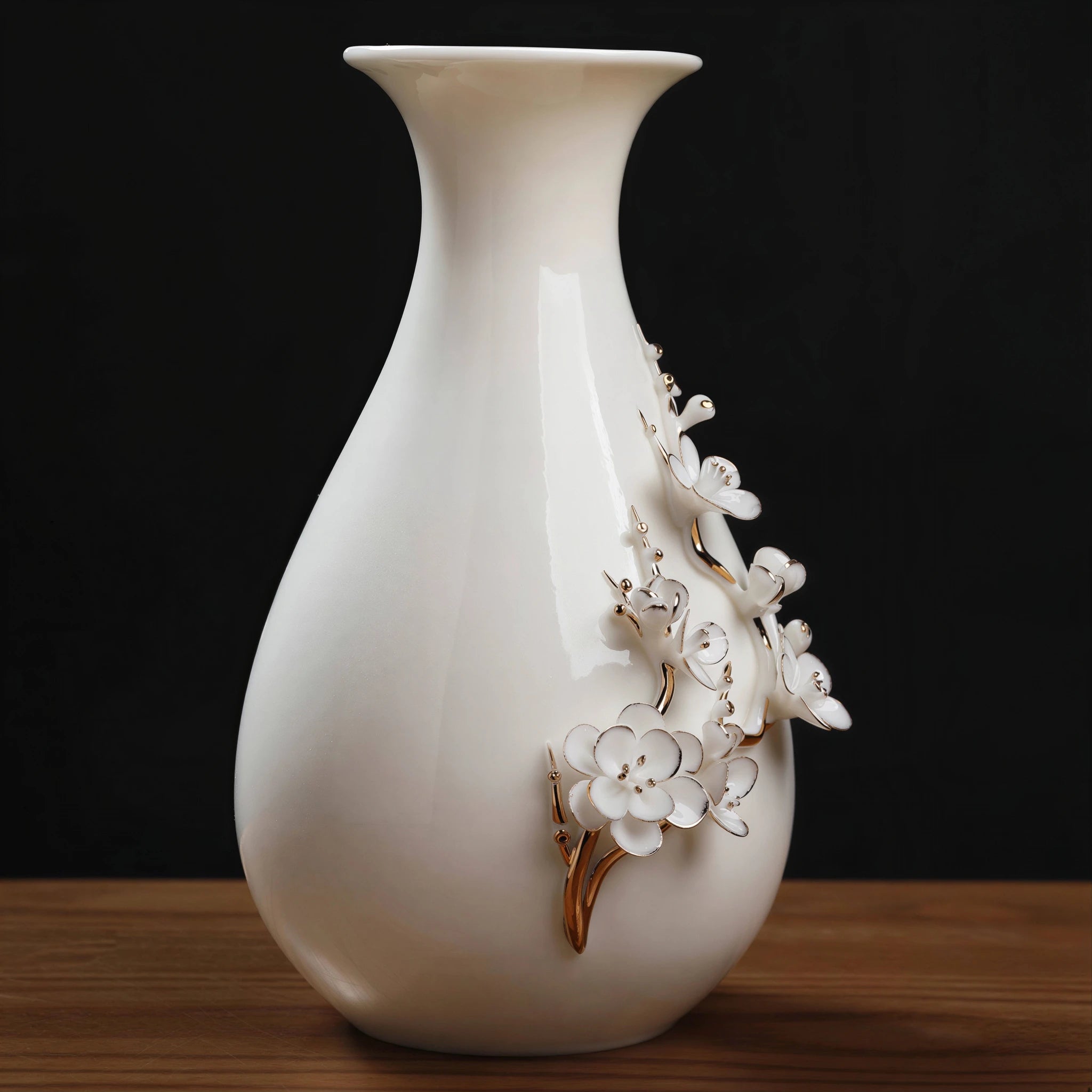 Close view of raised plum blossoms and gold-toned branches on white porcelain