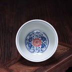 Interior lotus motif in underglaze red and cobalt blue