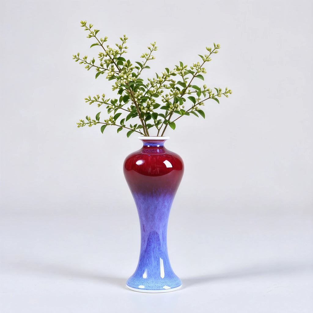 Tall rose-purple meiping vase holding a small leafy branch.
