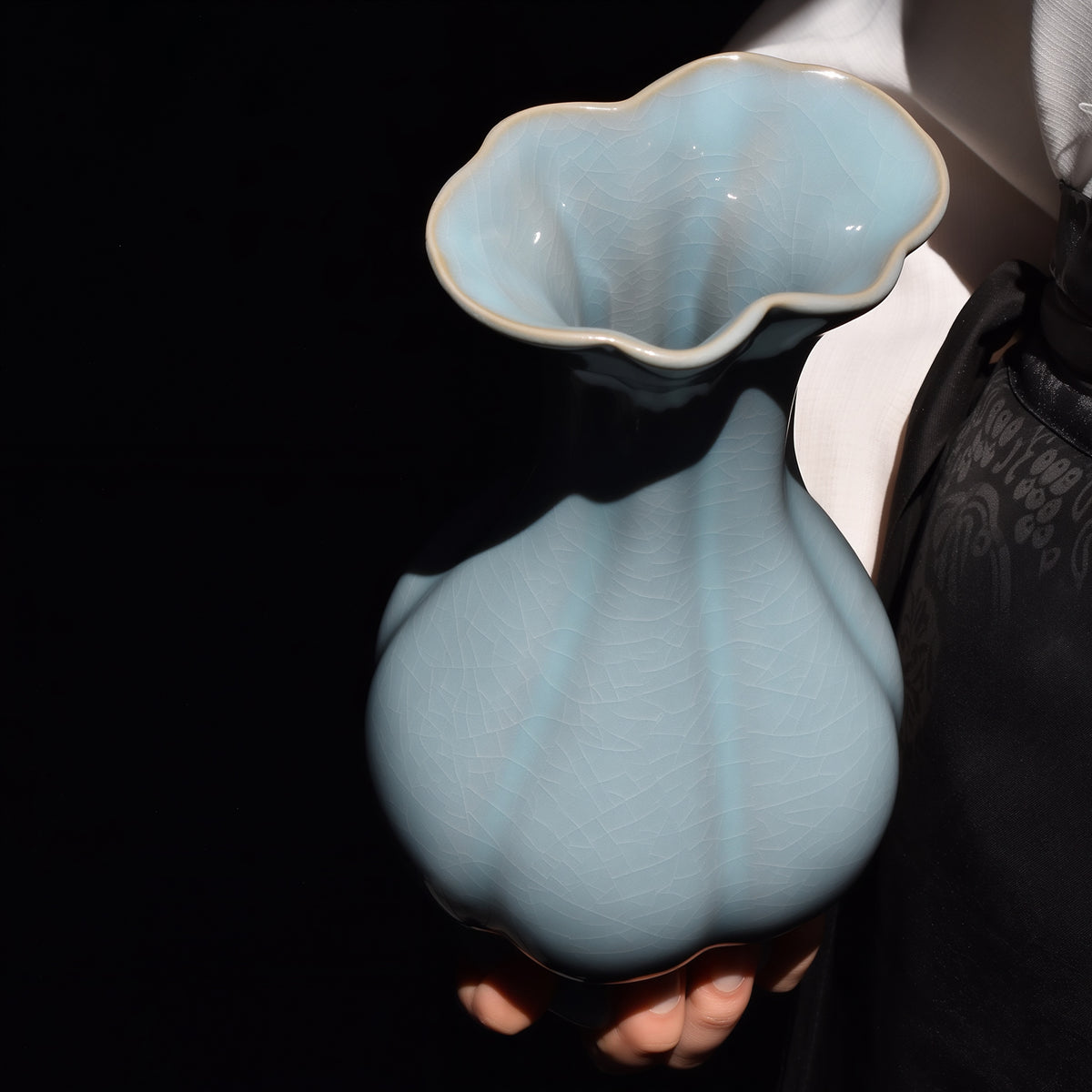 View into the flower-shaped mouth of the Haitang vase, showing pale blue glaze and fine crackle inside the rim.