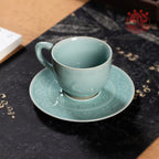Sky Blue celadon coffee cup on a dark stone tray