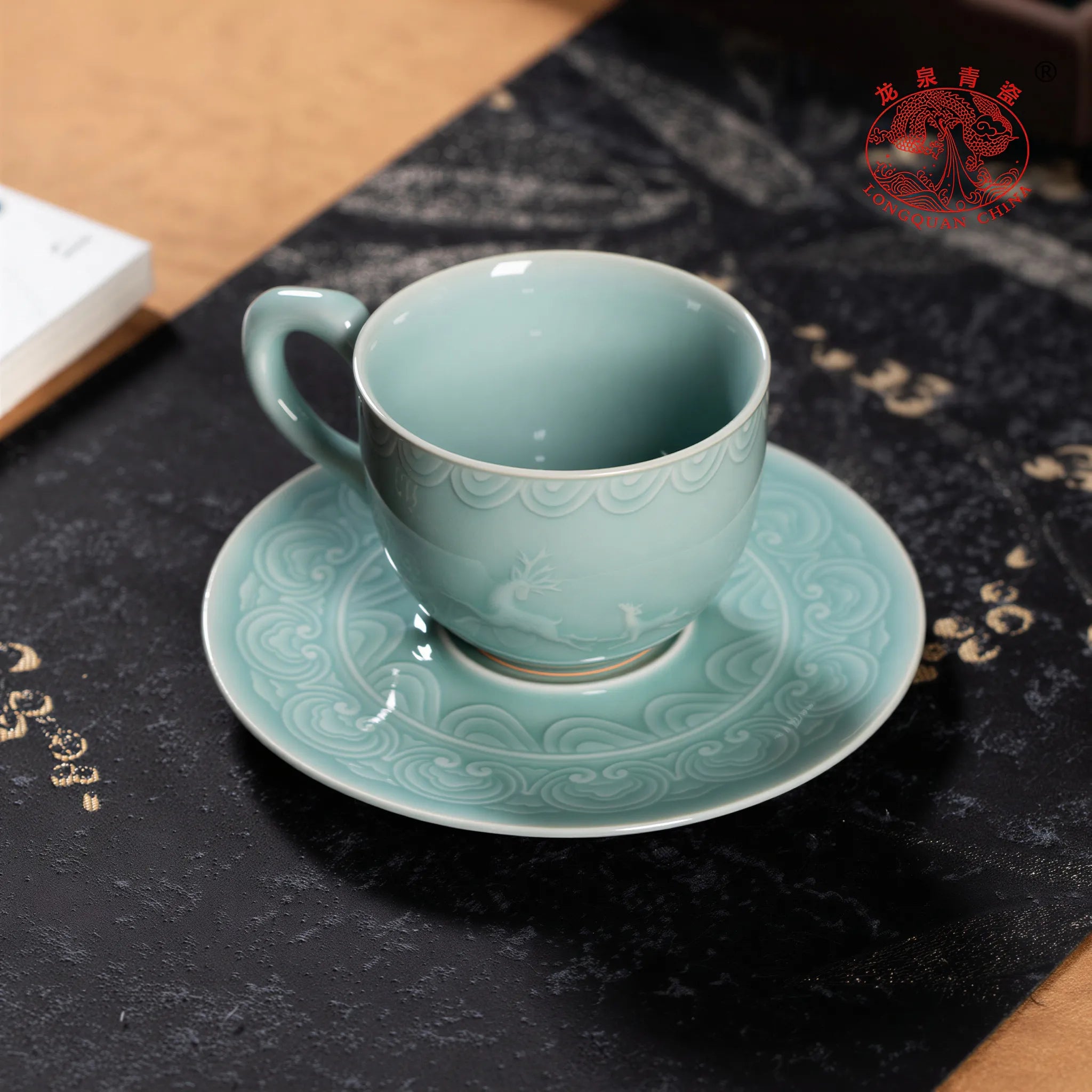 Sky Blue celadon coffee cup on a dark stone tray