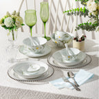 Spring Dawn floral porcelain bowls, plates, and condiment dishes arranged across a table set for two.