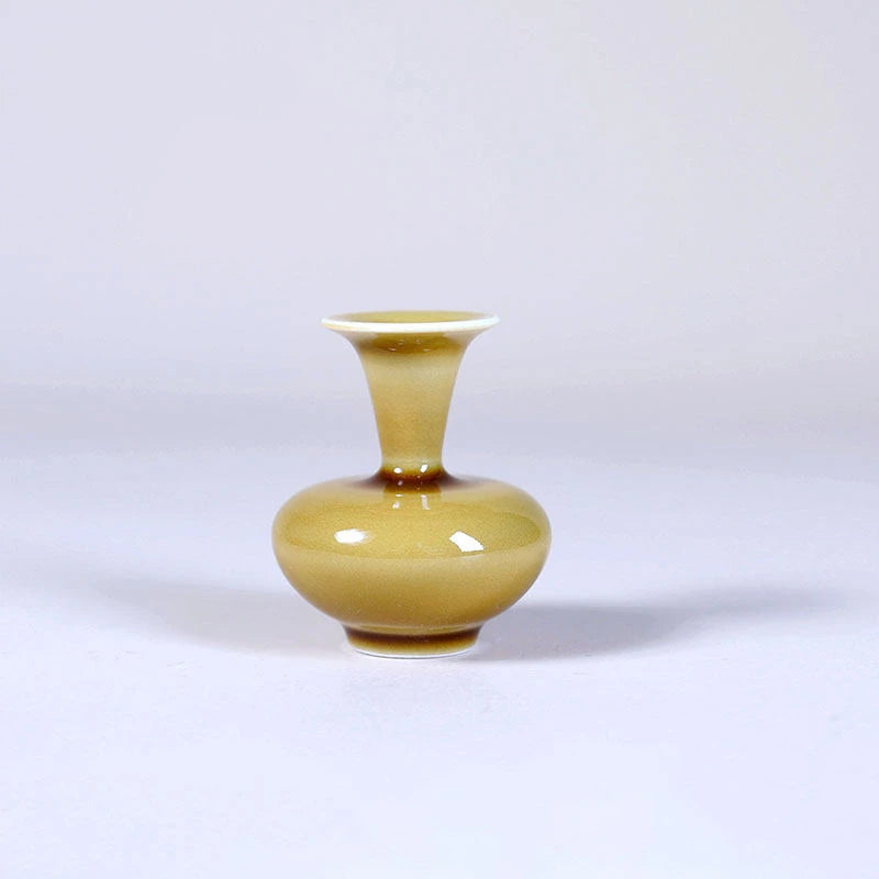 Squat luminous yellow porcelain vase with flared mouth