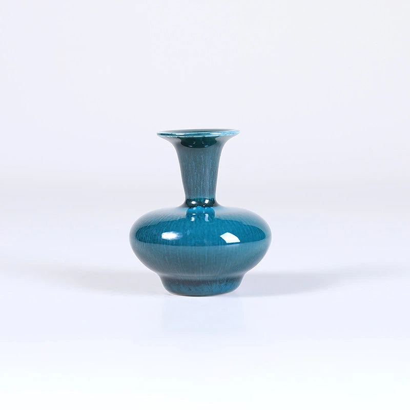 Squat peacock green porcelain vase with narrow neck