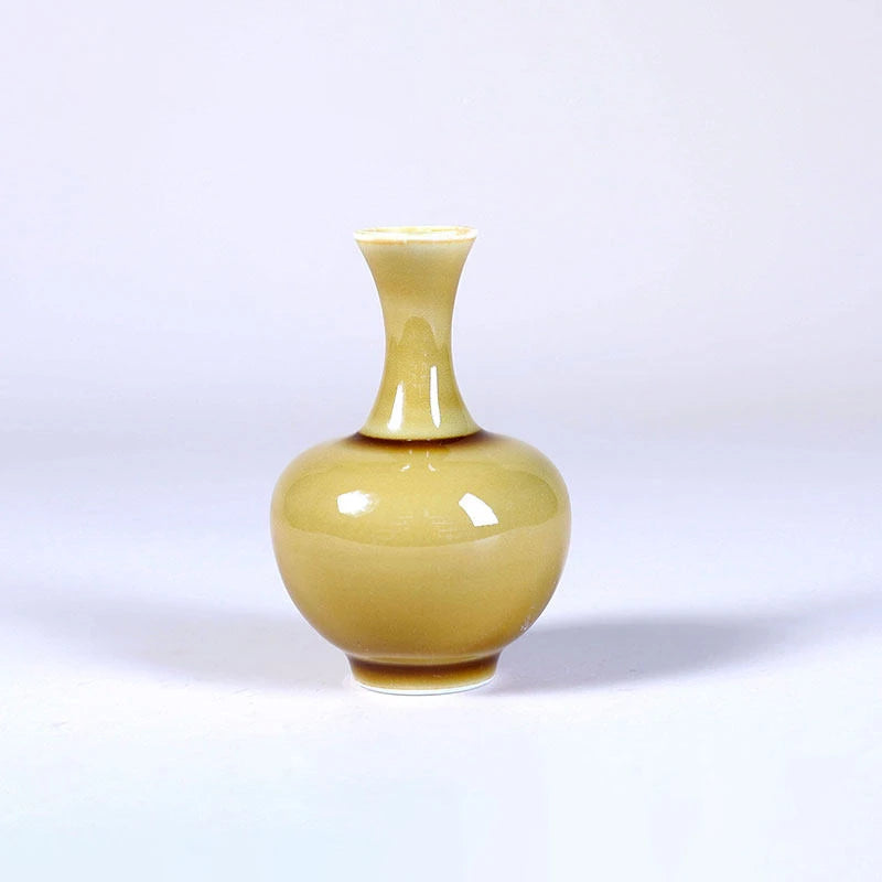 Tianqiu globular luminous yellow porcelain vase with narrow neck and flared mouth