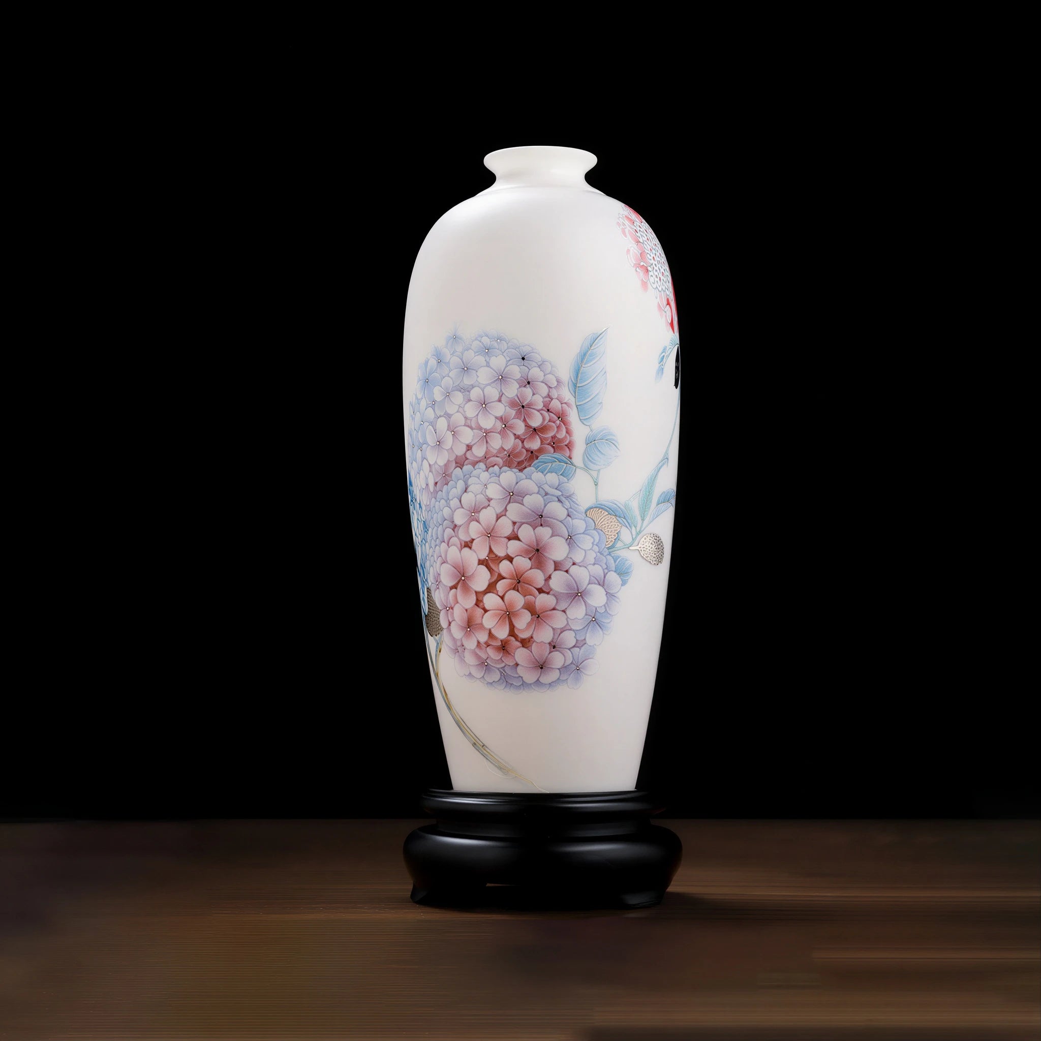 Front view of a translucent white porcelain Meiping vase with pink and blue hydrangeas