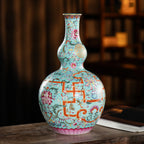 Continuous famille rose floral pattern across both gourd sections