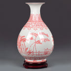 Full view of the red and white Yuhuchun vase on its fitted wooden stand
