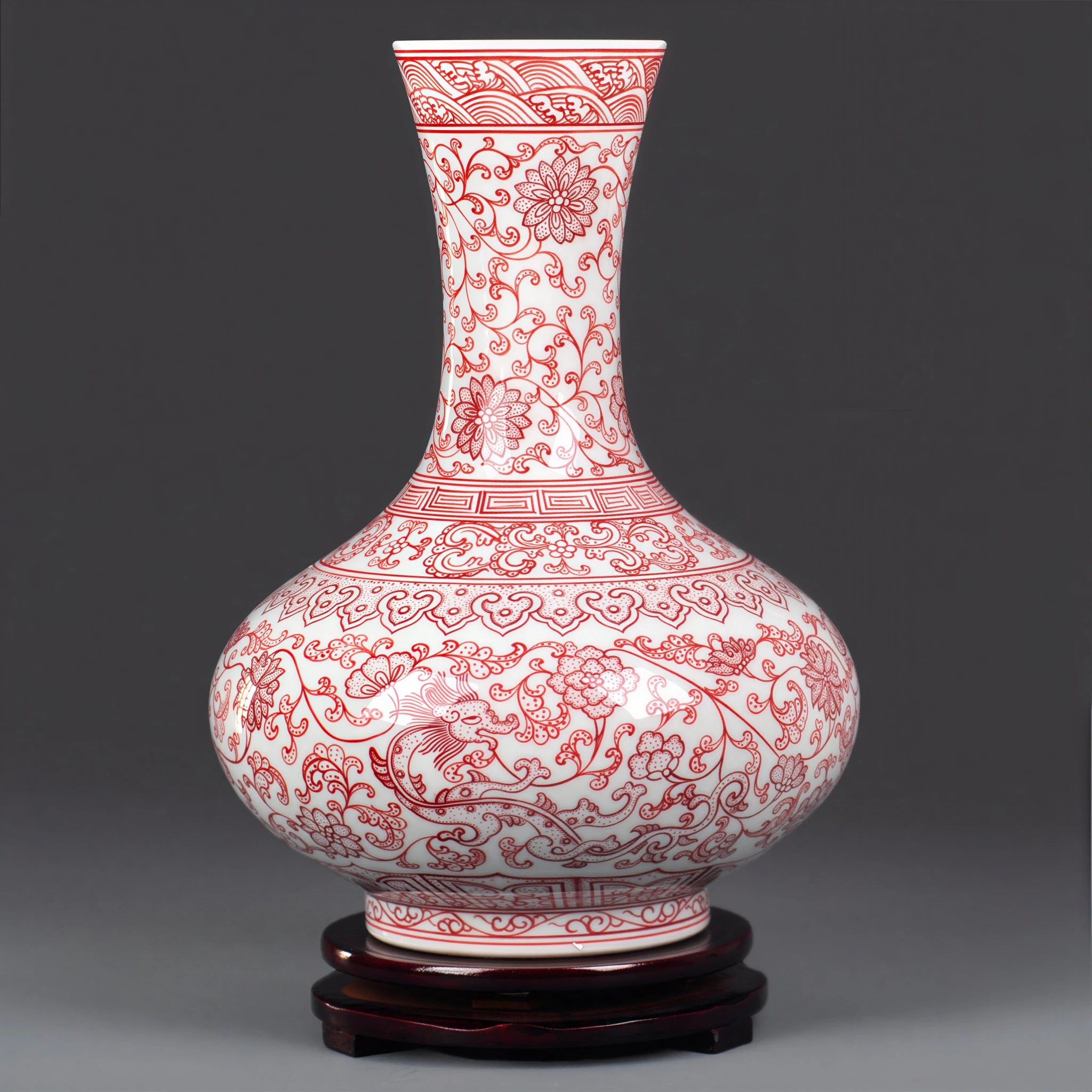 Full profile of the underglaze red lotus-scroll vase on a dark wood base