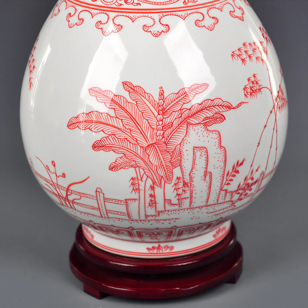 Close view of underglaze-red plantain leaves, garden rock and balustrade