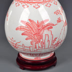 Close view of underglaze-red plantain leaves, garden rock and balustrade