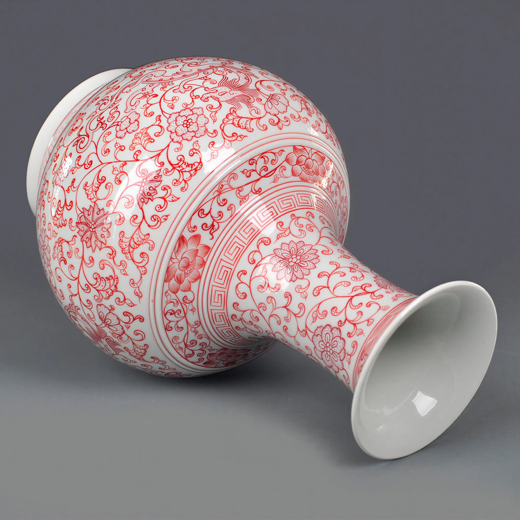Underglaze-red Shangping vase displayed on a dark wooden stand