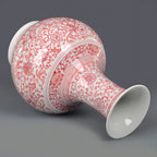 Underglaze-red Shangping vase displayed on a dark wooden stand