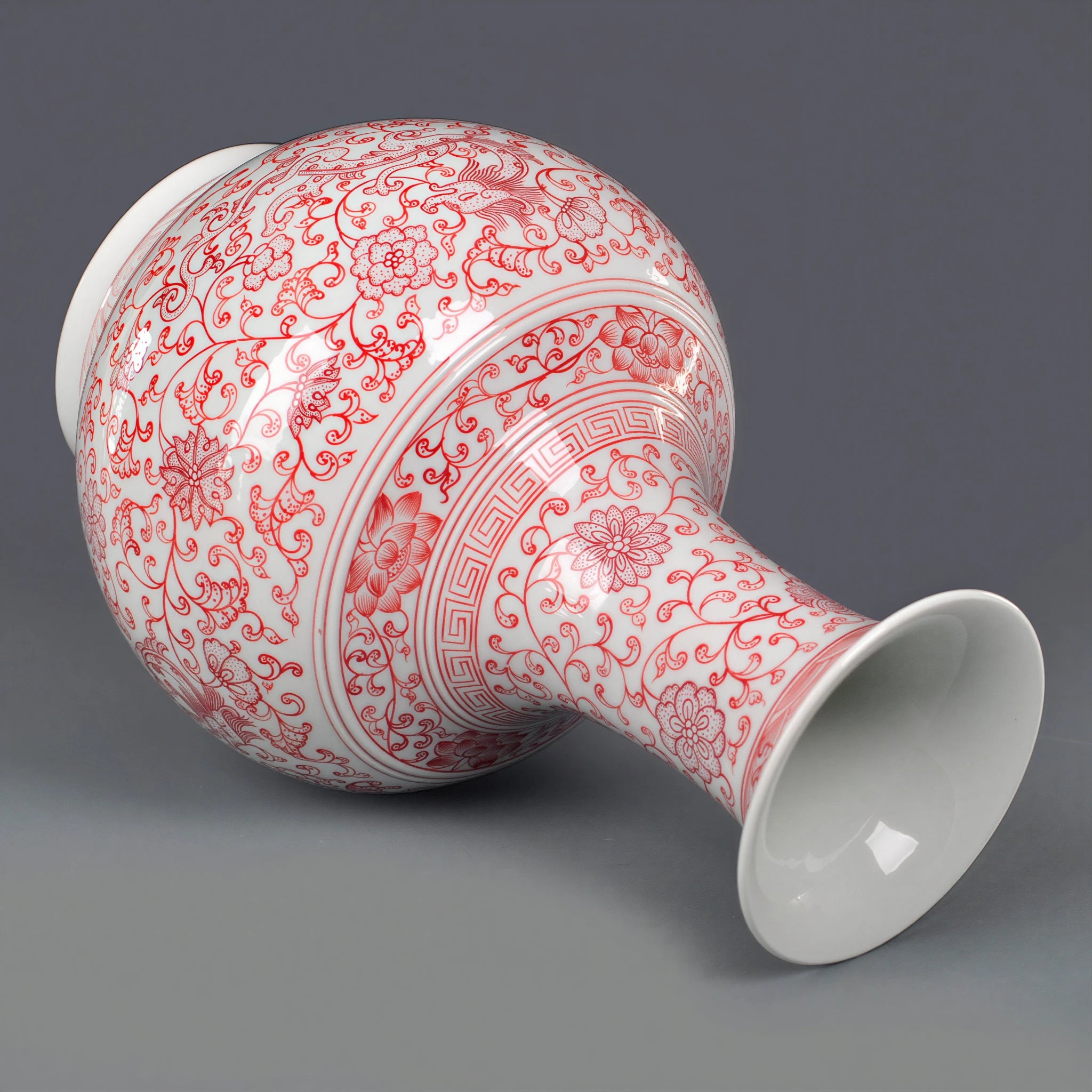 Underglaze-red Shangping vase displayed on a dark wooden stand