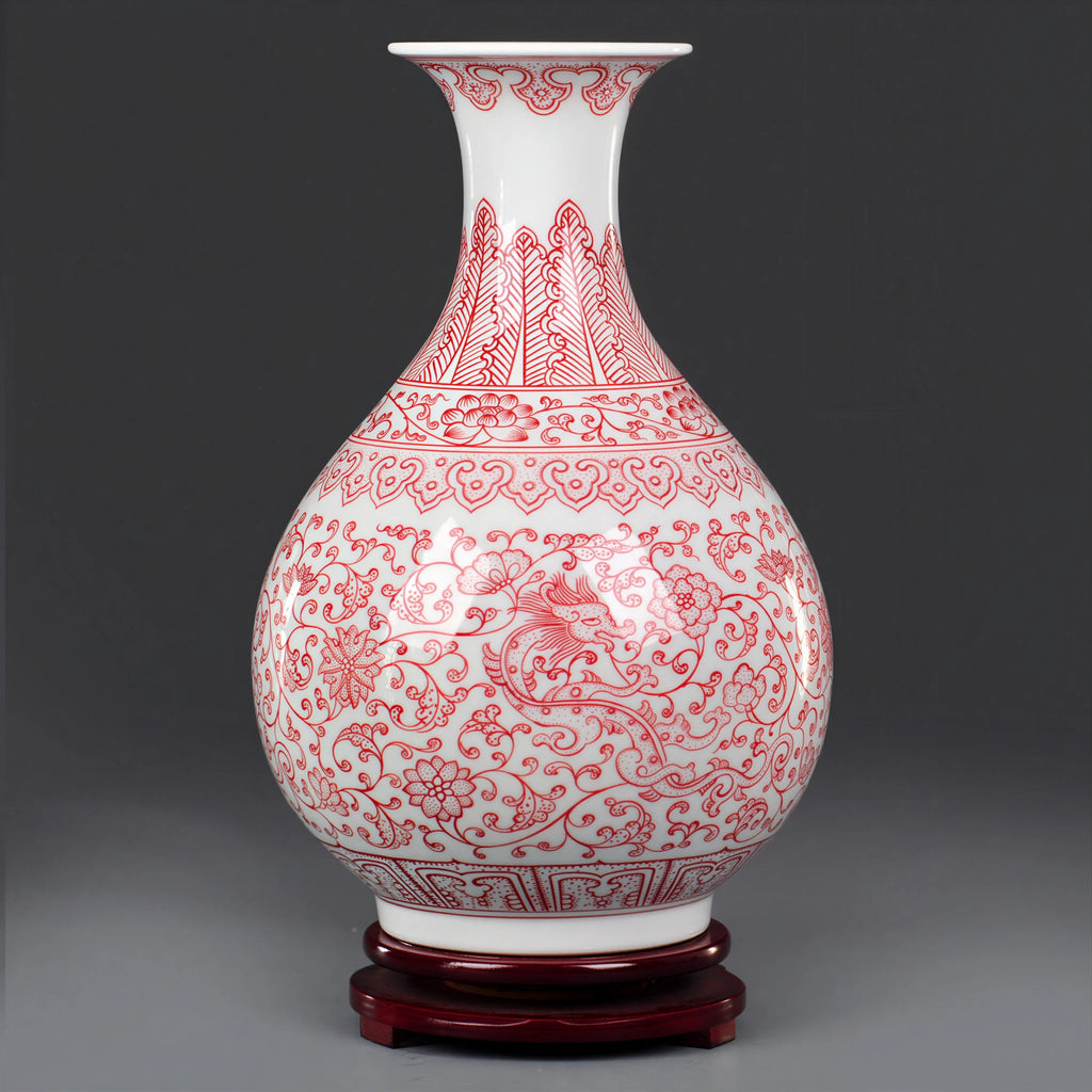 Full profile of the underglaze red Yuhuchun vase on a dark wood base
