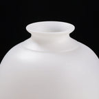 Close view of the flared mouth and smooth white shoulder of the hydrangea Meiping vase
