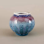 Wide-mouth rounded Jingdezhen porcelain vase with blue and violet reactive glaze