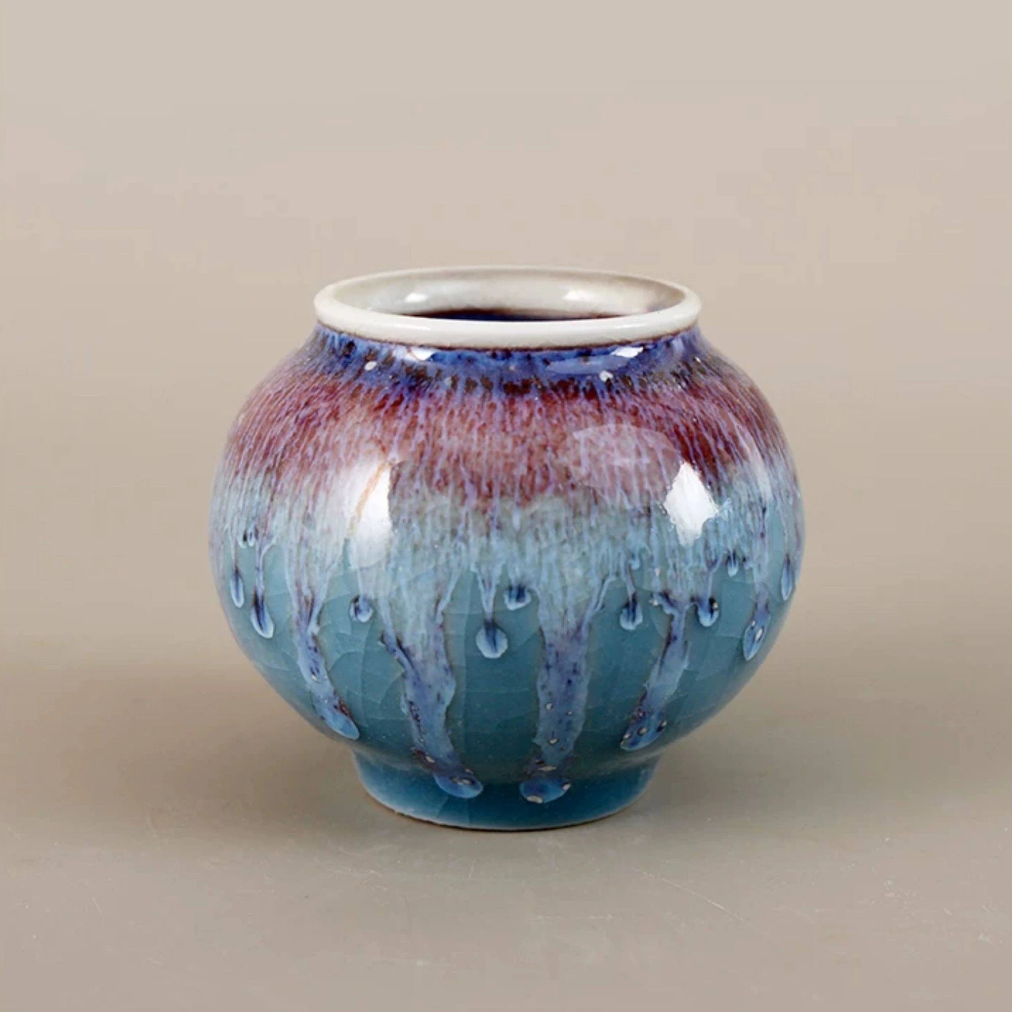Wide-mouth rounded Jingdezhen porcelain vase with blue and violet reactive glaze