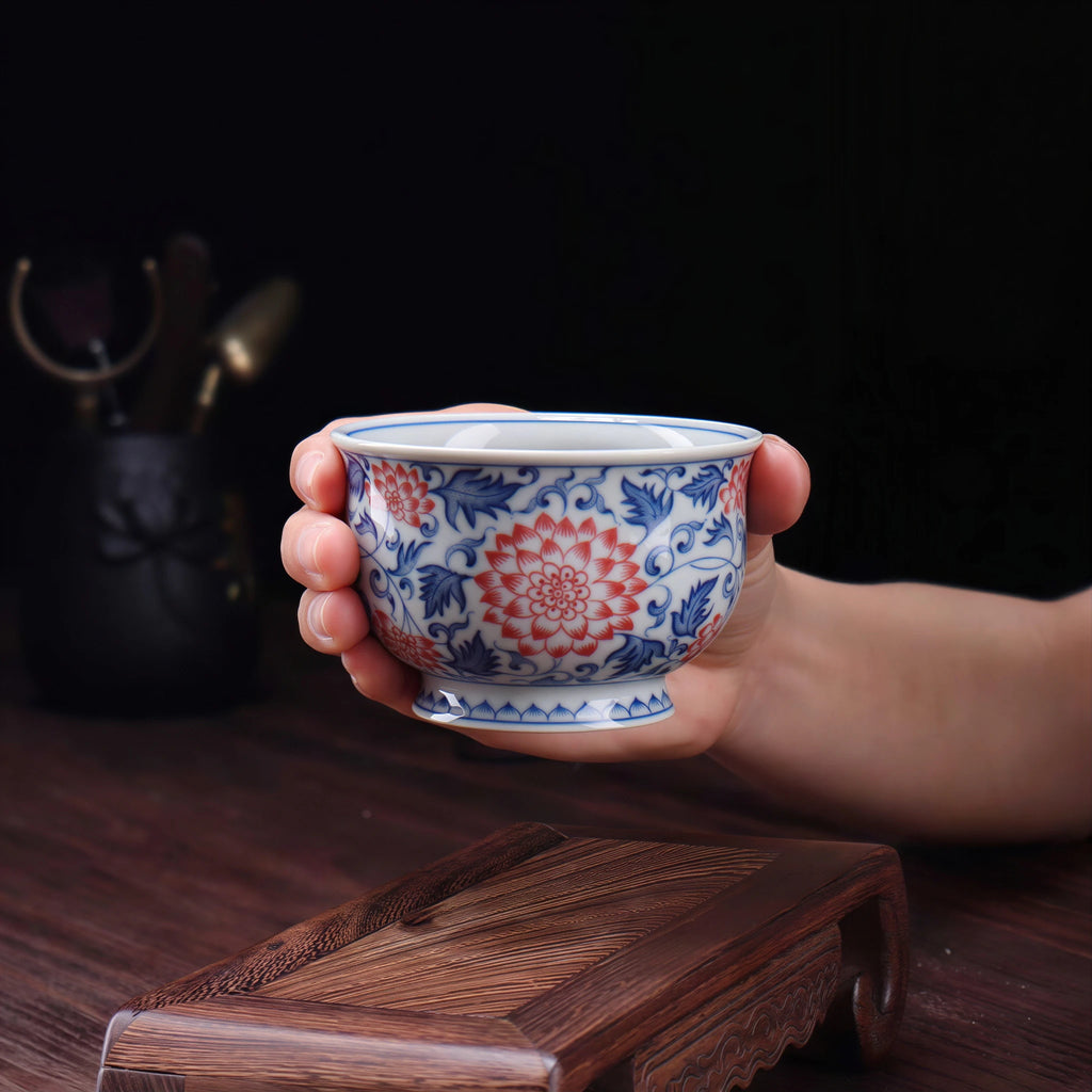 Wood-fired lotus teacup shown at hand scale
