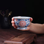 Wood-fired lotus teacup shown at hand scale
