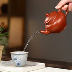Tea pouring from the 245 ml Xiao Ying Yixing teapot