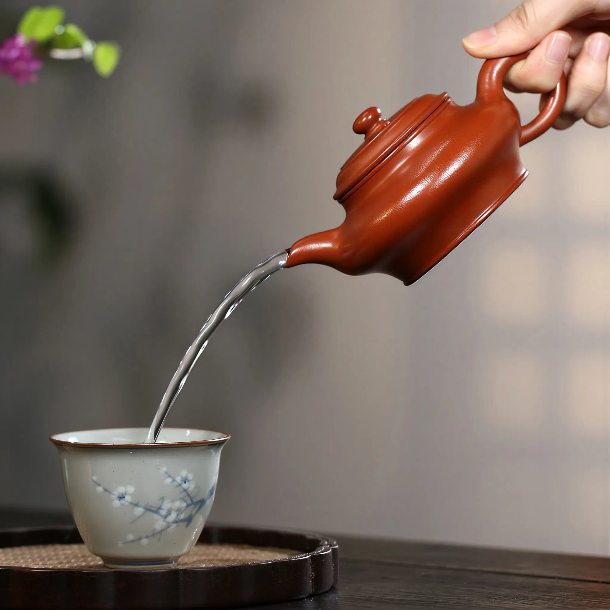Water pouring from the straight spout of the Xu Bian teapot