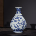 Display view of a Xuande-style blue-and-white Yuhuchun vase on a dark tabletop
