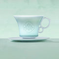 Profile of the carved peony coffee cup under pale Yingqing glaze