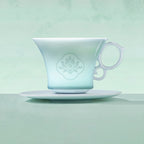Profile of the carved peony coffee cup under pale Yingqing glaze