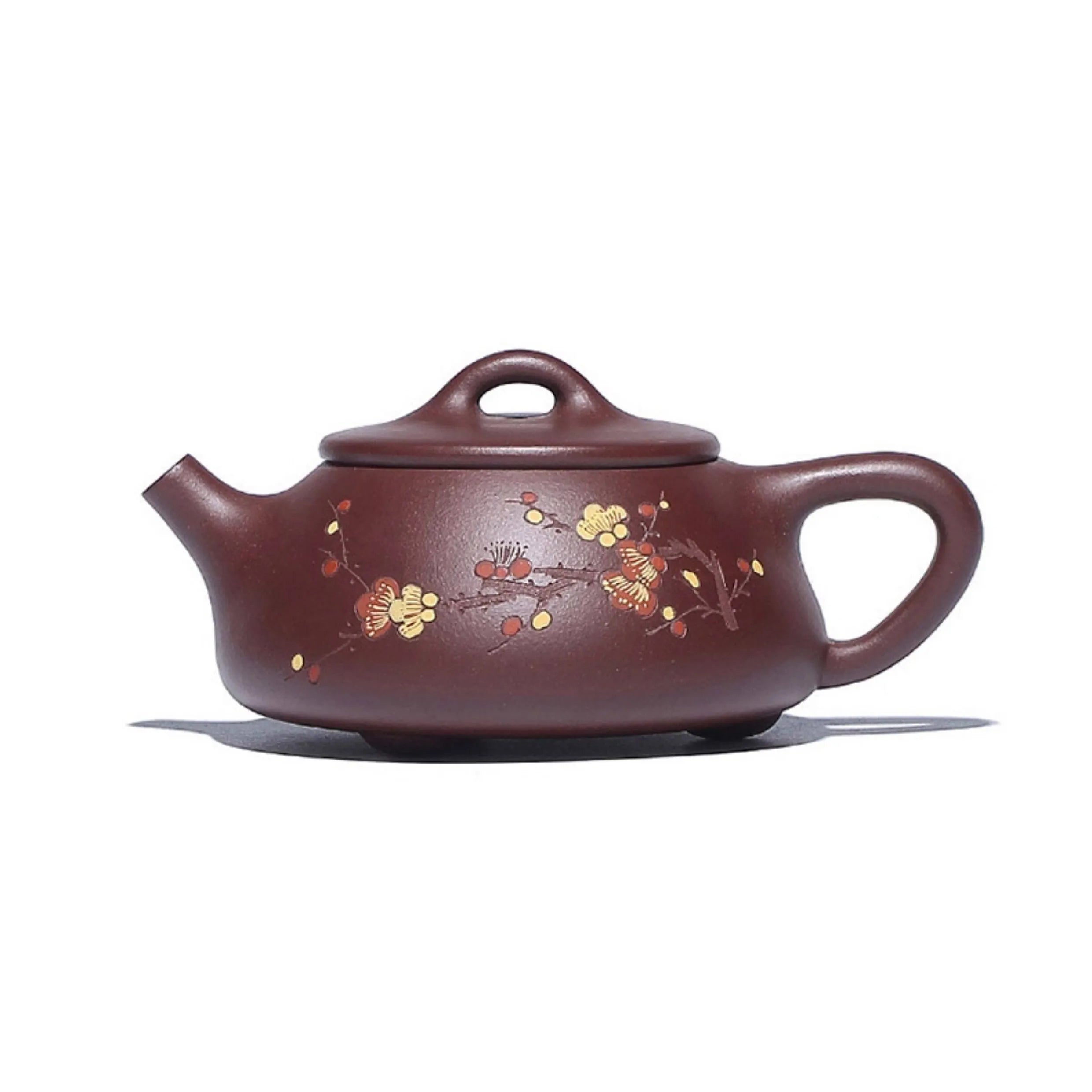 Side profile of the plum-blossom carved zini Shipiao teapot